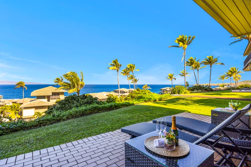 Peaceful lanai moments overlooking green lawns and blue water