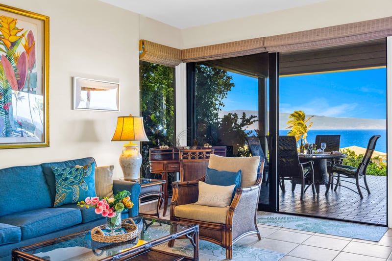 The expansive sliding glass doors create a seamless indoor-outdoor experience