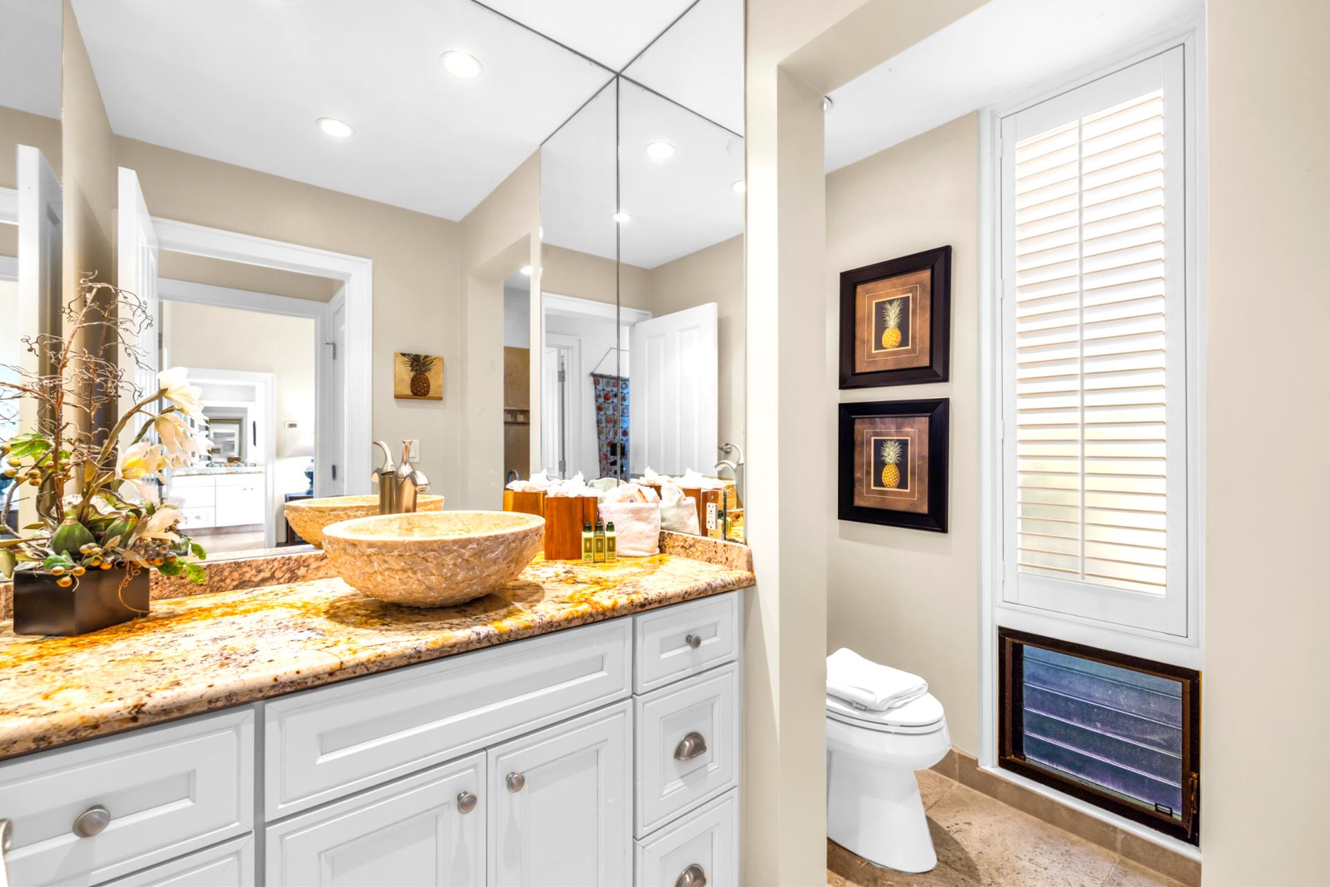 The half bath in the hallway offers convenience for everyone