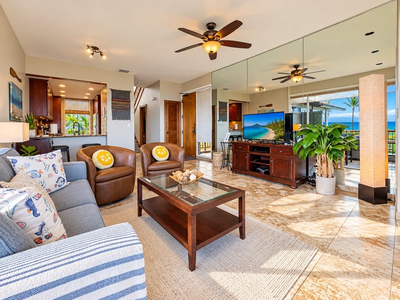 Ceiling fans, a mirrored wall, and a breakfast bar open to the kitchen give your living area a bright, connected feel. KBV-15B3