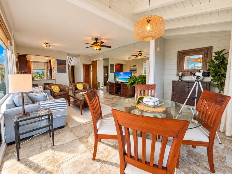 Your dining table sits within an open layout that connects the living room, kitchen bar, and entry door. KBV-15B3