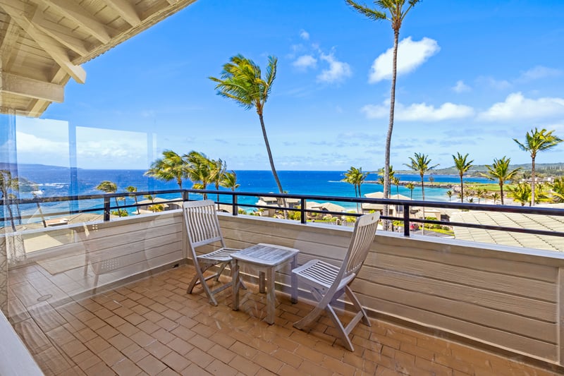 Sip, relax, and soak up the sea breeze—your private perch above palm-lined shores awaits     