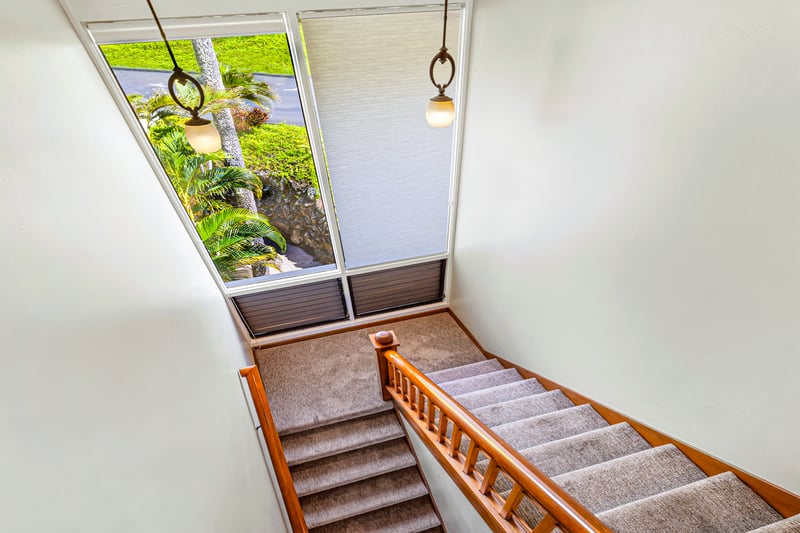 Light pours in from above, casting a warm glow on every step of your arrival     