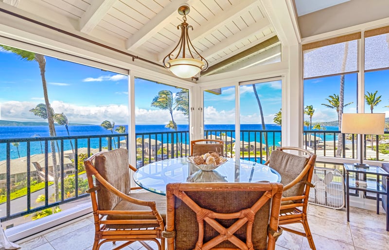 Where rattan charm meets coastal luxury—enjoy island meals surrounded by glass and sky     
