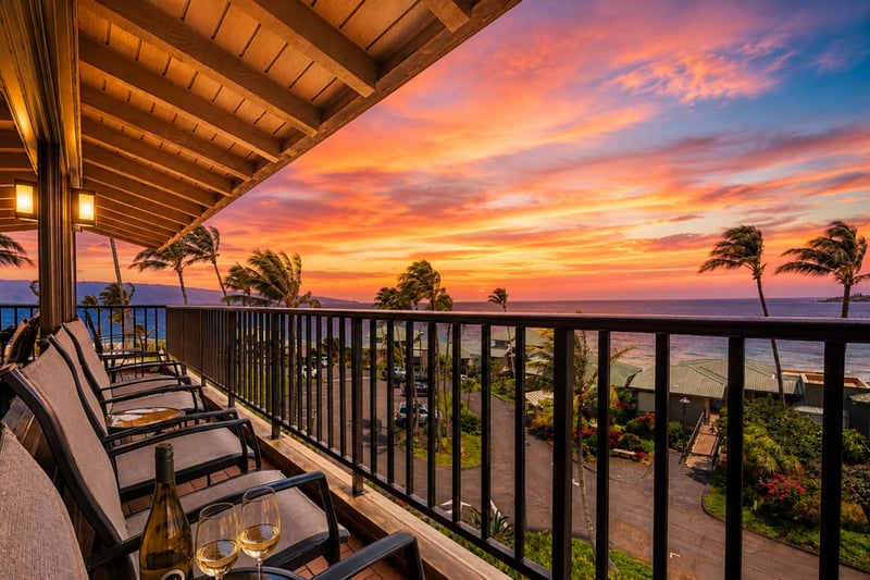 Your lanai comes alive at sunset, with lounge seating for the group and layered views of the coastline below.