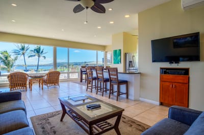 Stylish and serene, this living area invites you to unwind after a beach day with its cozy couch and open layout