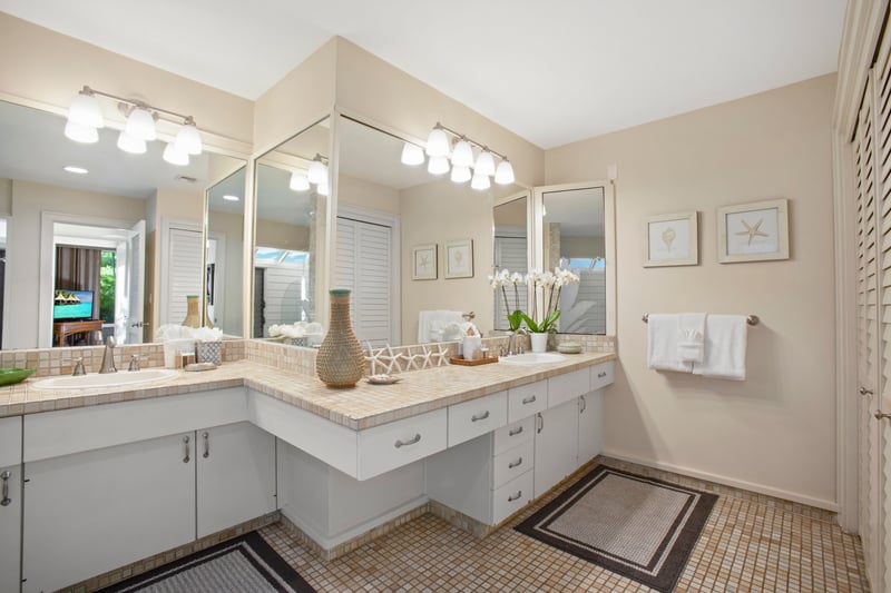 Sunshine streams in as you freshen up in this mosaic-tiled beauty—complete with modern fixtures and plenty of pampering space   