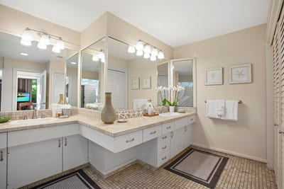 Sunshine streams in as you freshen up in this mosaic-tiled beauty—complete with modern fixtures and plenty of pampering space