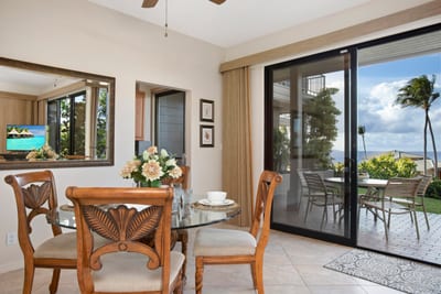 Set the table and open the sliding doors—this tropical dining room is made for sunny bites and breezy nights