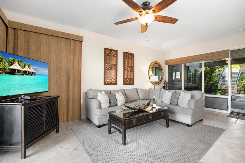 Sip, sit, and soak in paradise—your island escape starts right in this sunlit living room   