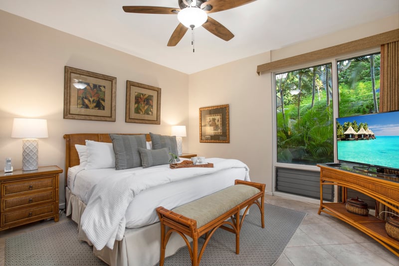A serene sanctuary with warm woods, soft linens, and a tray of treats that says, “stay in bed a little longer.”   