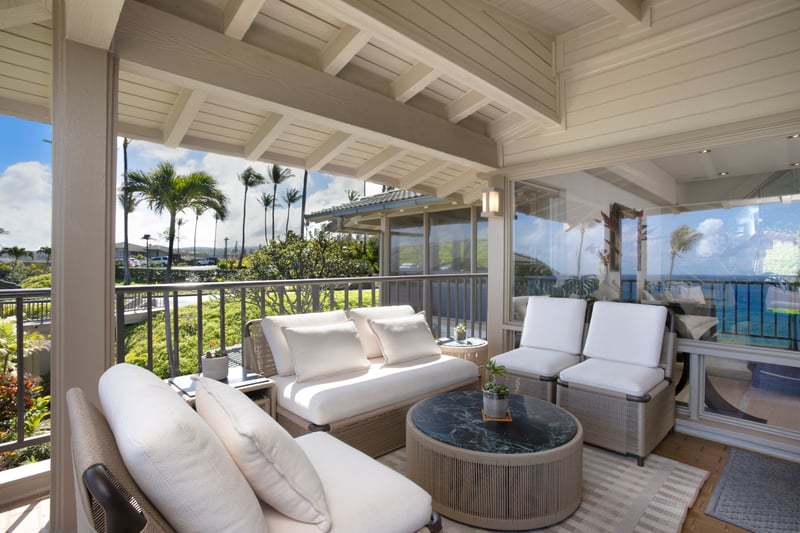 Ocean breeze, comfy seats, and palm trees waving hello—this lanai is basically a vacation mood board come to life