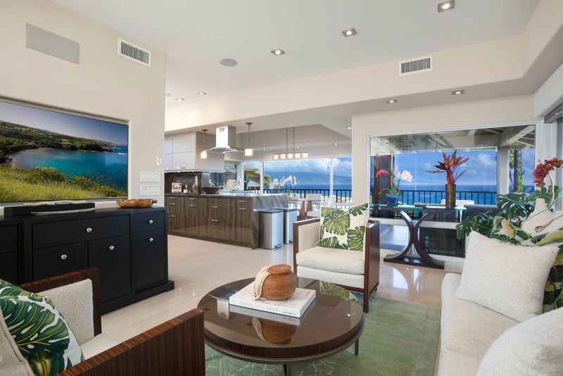 Palm prints, ocean hints, and a swirl of style—living room goals, tropical edition