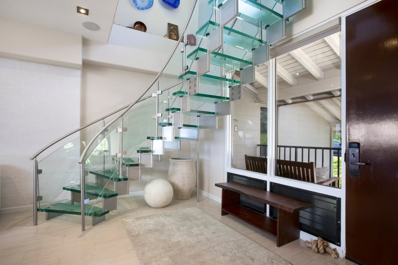 More curves than a beach wave—this staircase is a design dream with a sea view bonus