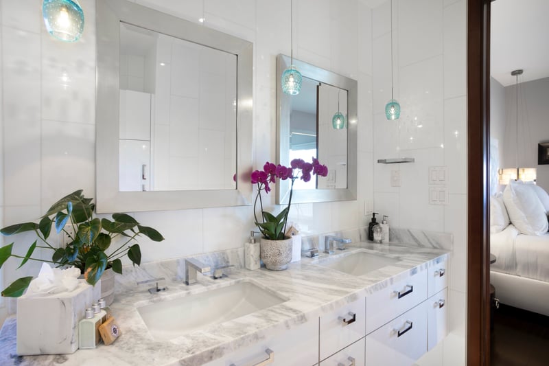 With twin sinks, lush light, and a tub to dream in, this bathroom transforms every stay into a blissful getaway