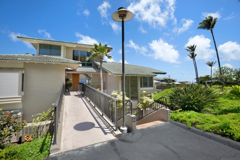 A beautiful entryway framed by island foliage and tropical sunshine—Aloha awaits!