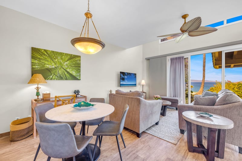 Open-concept living area with cozy seating, dining table, and direct view into the kitchen — perfect for gathering and entertaining. KBV-24G3