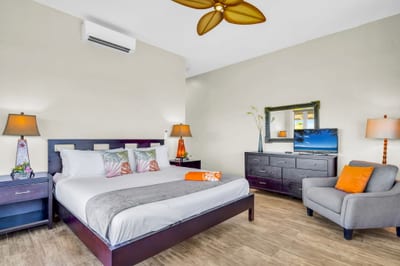 Spacious bedroom with a King-sized bed and ample seating. KBV-24G3