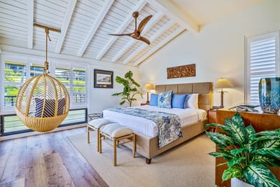 This isn’t just a master bedroom — it’s your tropical sanctuary with swing chair vibes and sunlight galore