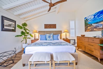 Whitewashed beams, ocean-hued decor, and cozy textures — it’s giving 'beachy bliss with boutique flair'