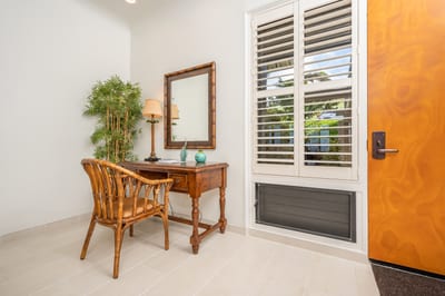 Welcome home! A cozy workspace by the window, perfect for planning island adventures KBV-28G2