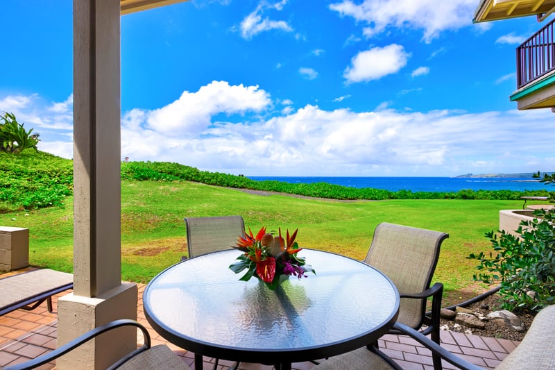 Unwind with sweeping ocean views and lush greens from your private lanai—where tranquility begins