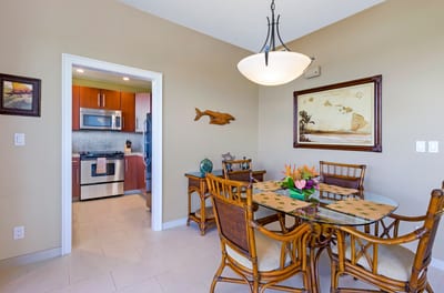 Gather around in island style, this tropical dining nook blends warmth, charm, and a fully equipped kitchen