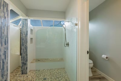 Step into a bathroom oasis with clean design, spacious layout, and thoughtful comfort-focused details