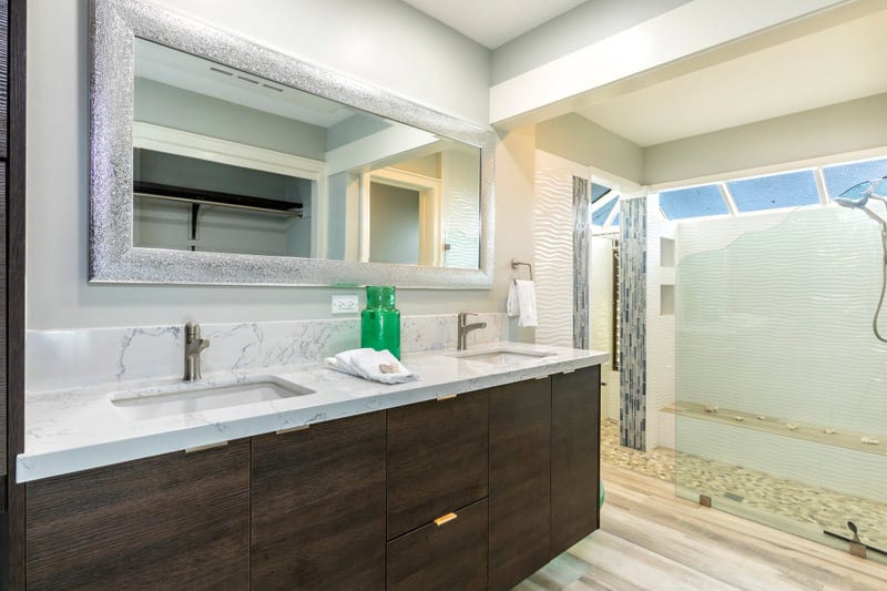 Chic and inviting, this modern master bathroom features rich wood tones and stunning outdoor views KBV-32B2