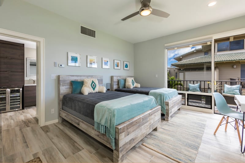 Chic furnishings and sea-toned accents create a peaceful retreat with easy access to outdoor dining and view