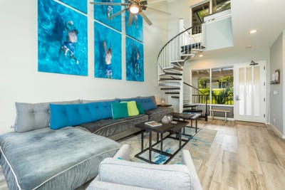 With an open layout that leads directly to an oceanfront lanai, this living room is your launchpad to paradise