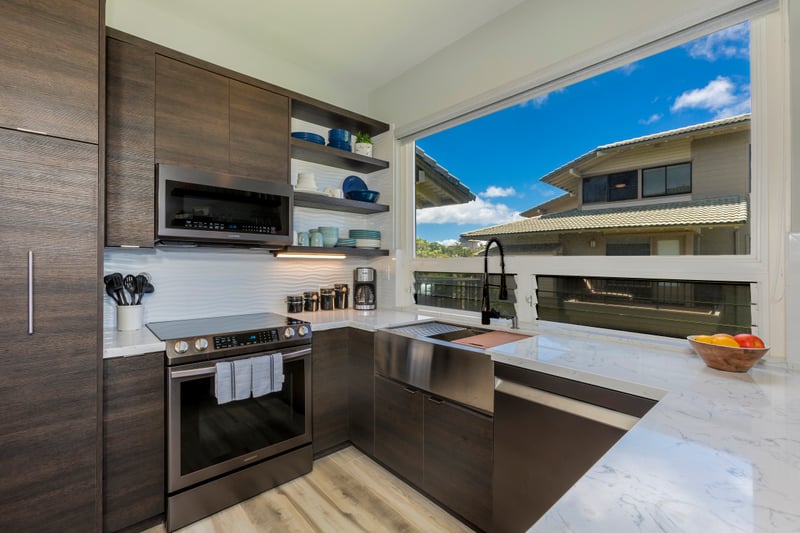 From stone countertops to stainless steel appliances, this airy kitchen balances sleek style with tropical soul