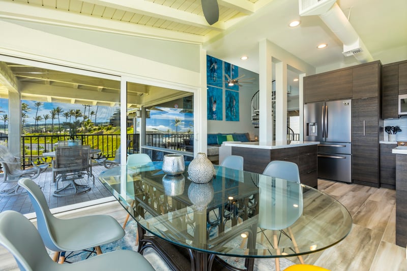 A bold mix of colors and coastal views makes this dining space unforgettable—perfect for sunrise to sunset