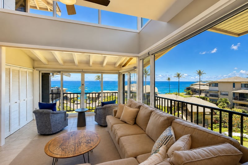 Gather in your inviting living room, where generous seating and wide balcony doors keep the ocean scenery close.