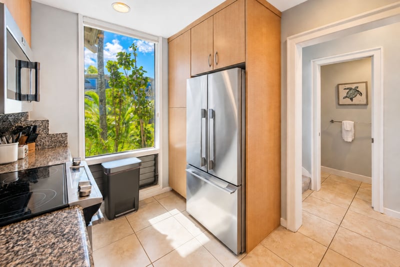 Full size appliances and ample cabinetry give your kitchen practical space for groceries, drinks, and meals during your stay.