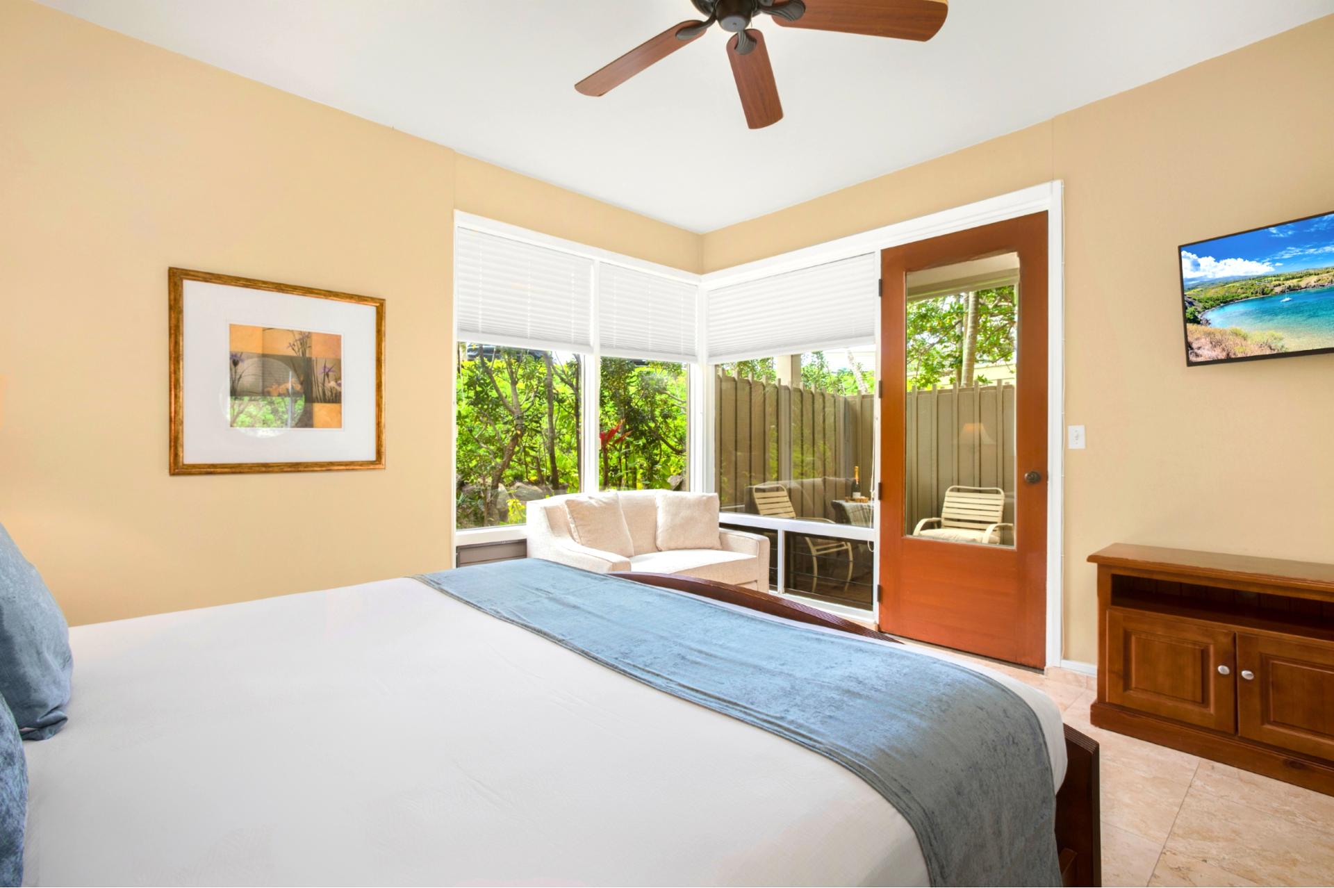 Drift into relaxation in this serene bedroom with tropical light and tasteful decor