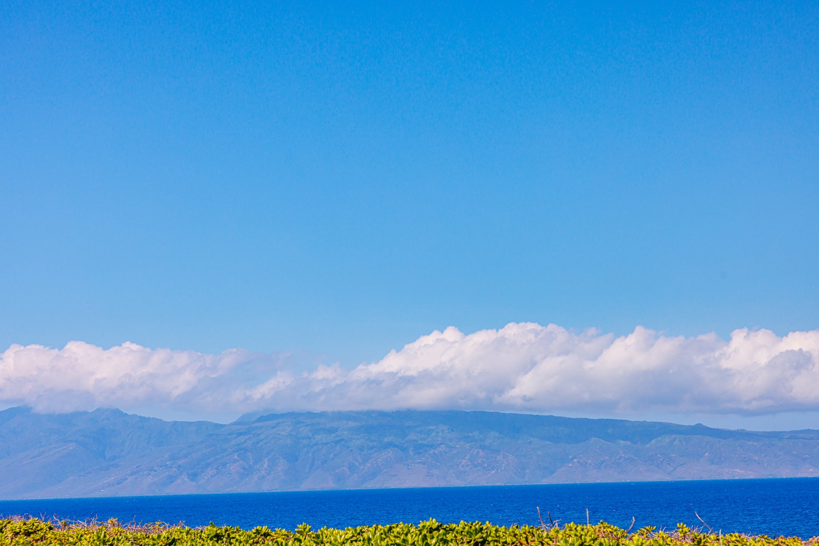 Endless ocean views stretch toward the horizon just beyond your lanai.
