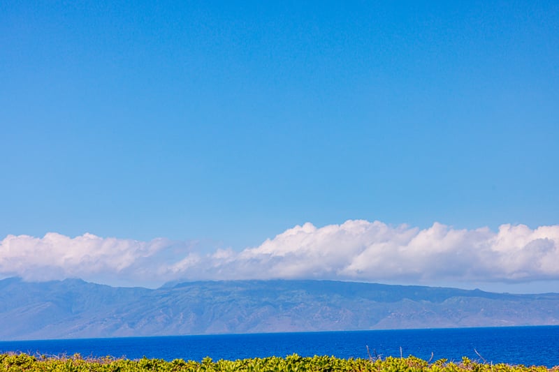 Endless ocean views stretch toward the horizon just beyond your lanai.