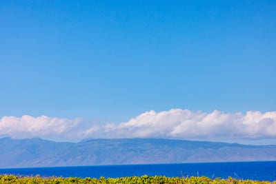 Endless ocean views stretch toward the horizon just beyond your lanai.