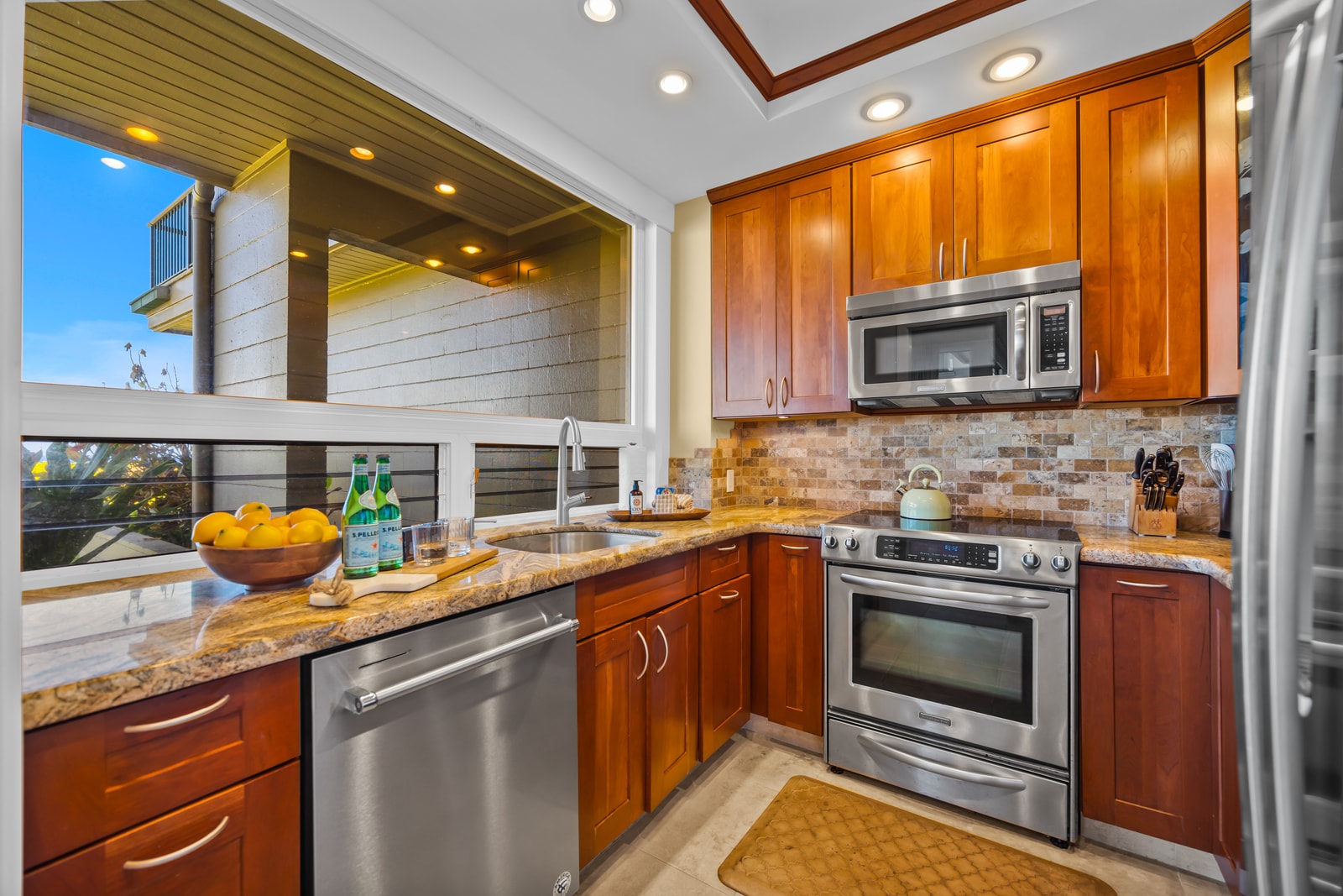 Fully equipped kitchen with stainless appliances and granite counters makes home cooking a breeze.
