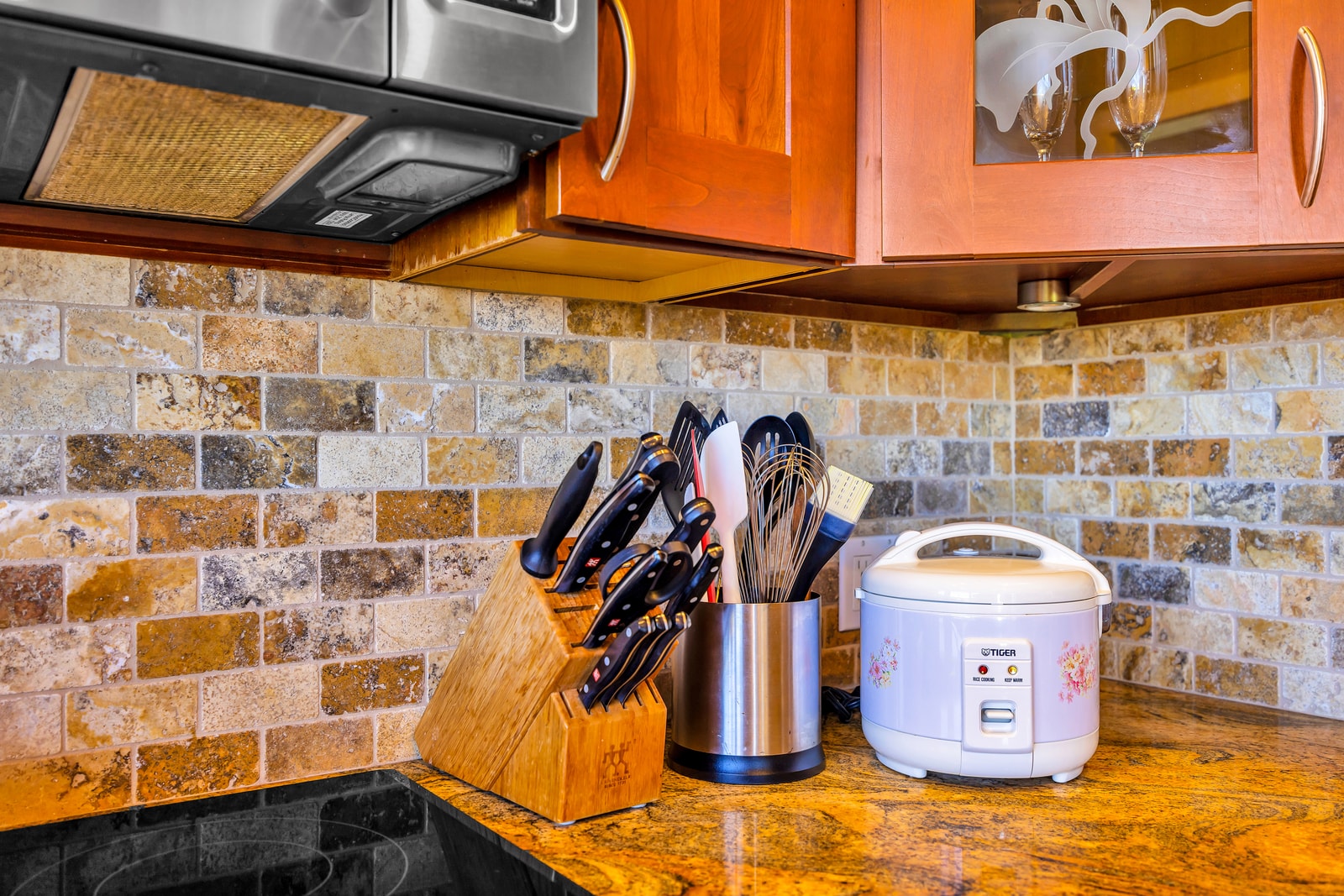 Cookware and small appliances are easily accessible for quick breakfasts or full dinners.