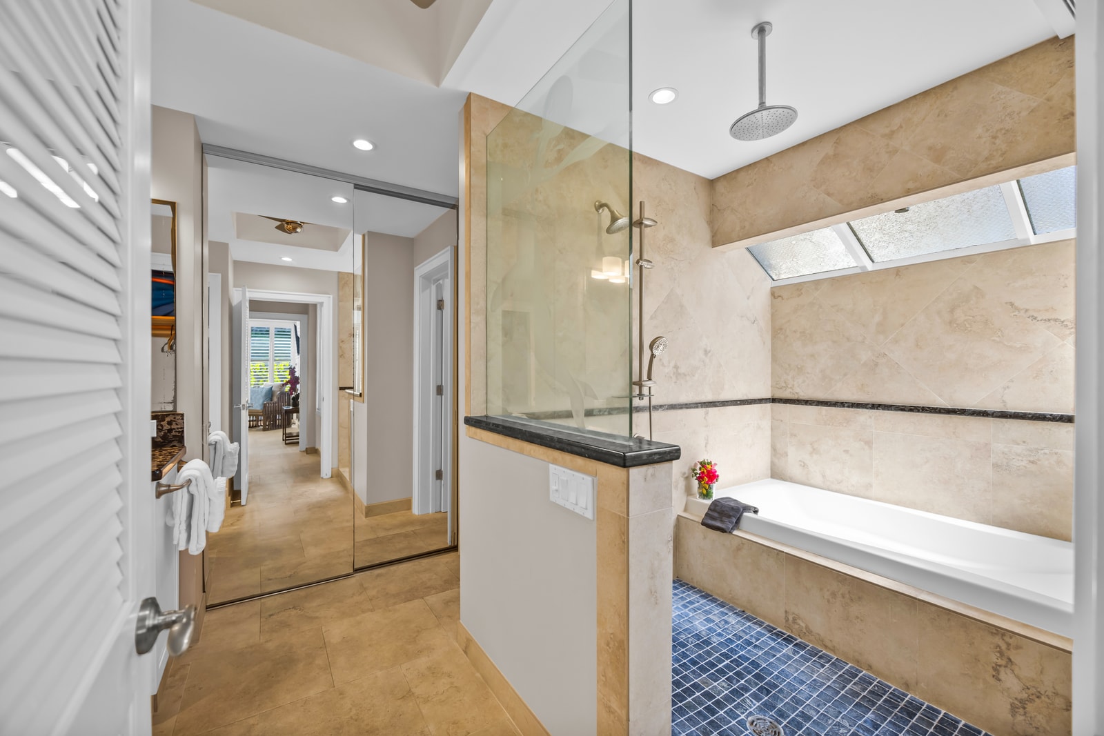 Clean lines and built-in shelving add function to your en-suite space.