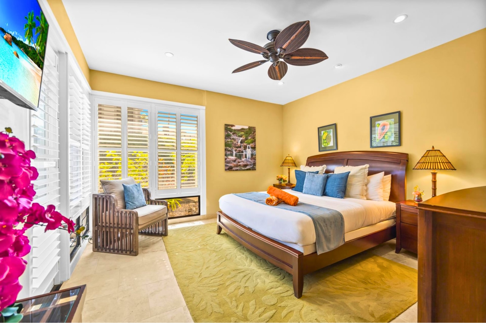 Bright and welcoming primary bedroom with a King bed and easy access to your private lanai.