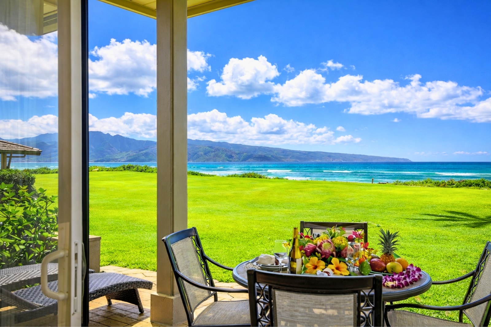 Dine al fresco with sweeping ocean and golf course views from your spacious ground-floor lanai.