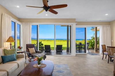 Enjoy direct lanai access and ocean views from your open-concept living room with a sofa sleeper.