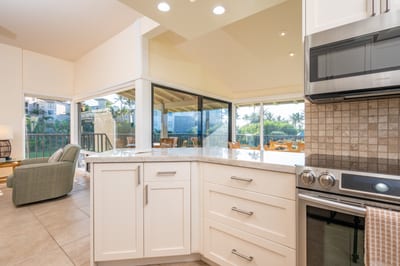 This gourmet kitchen blends sleek modern appliances with island elegance—perfect for relaxed mornings or evening feasts