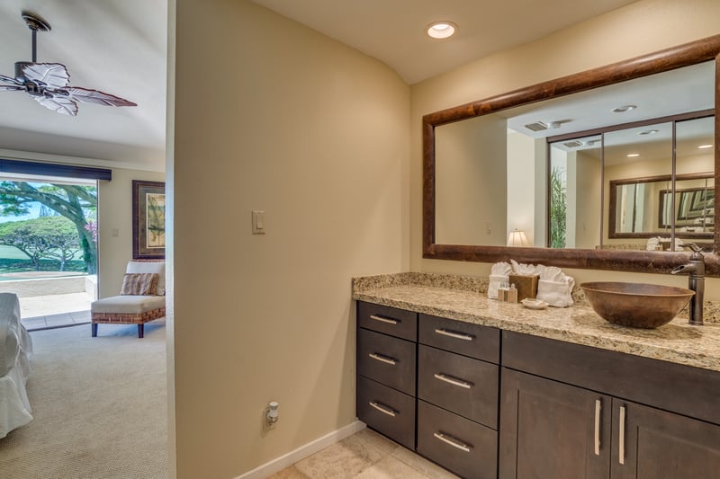 A tranquil retreat of refined elegance, where the soaking tub beckons and natural light dances across custom tilework and rich finishes.    