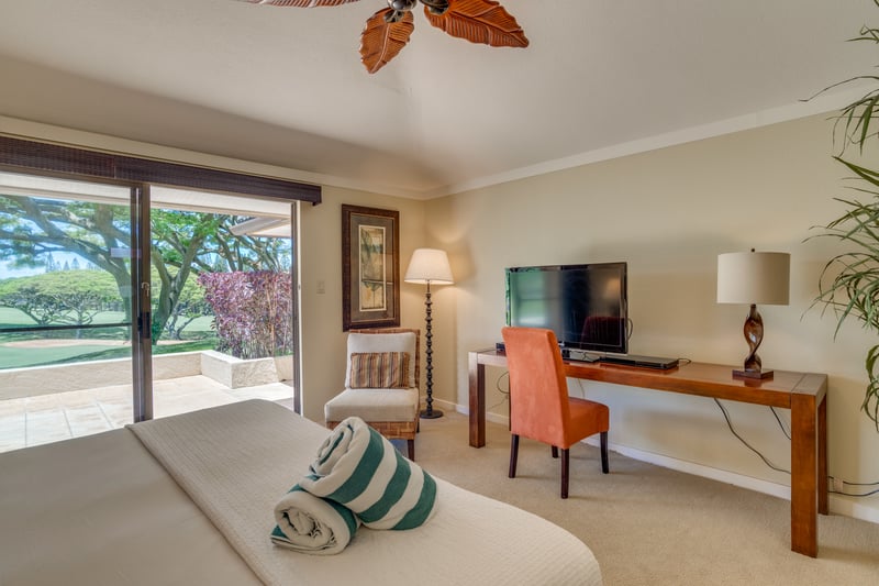 This inviting guest room brings joy with its pops of color, comfy chair, and a peek outside to lush, tree-lined serenity KGV-14P3