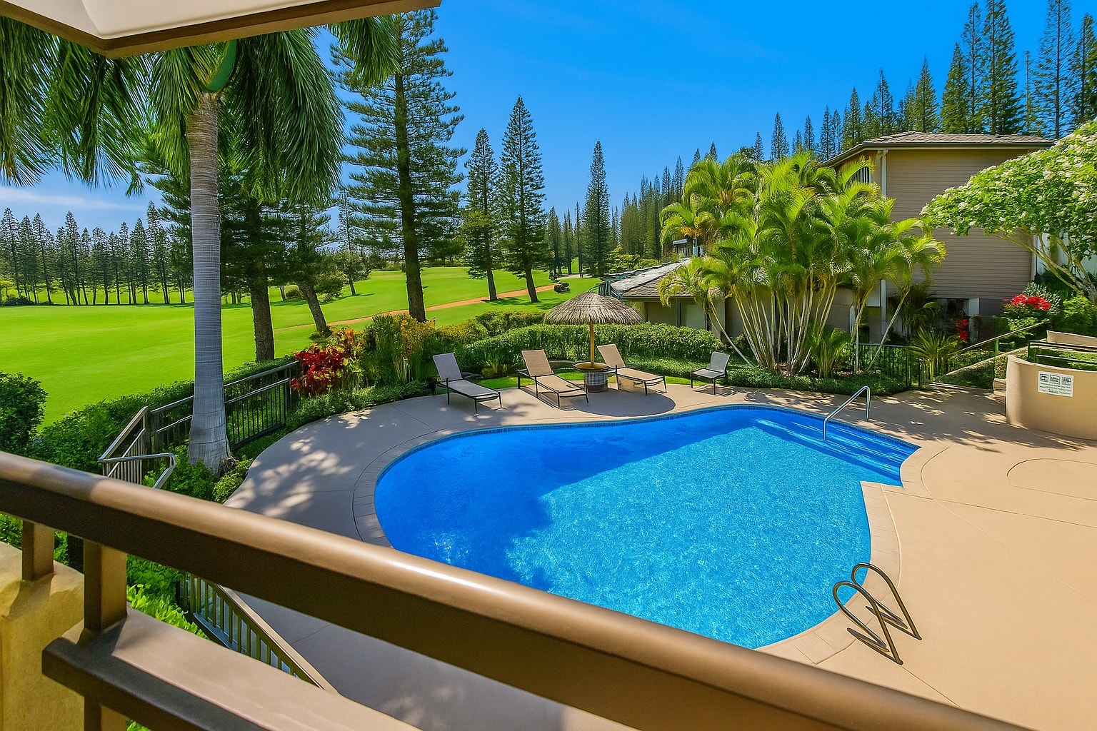 Your resort-pool and tropical-green view sets the tone for splashy mornings and chilled sunset lounging