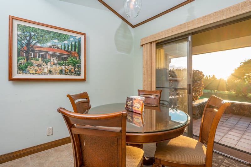 Cozy dining space with sunset views and local island artwork. KGV-16P3